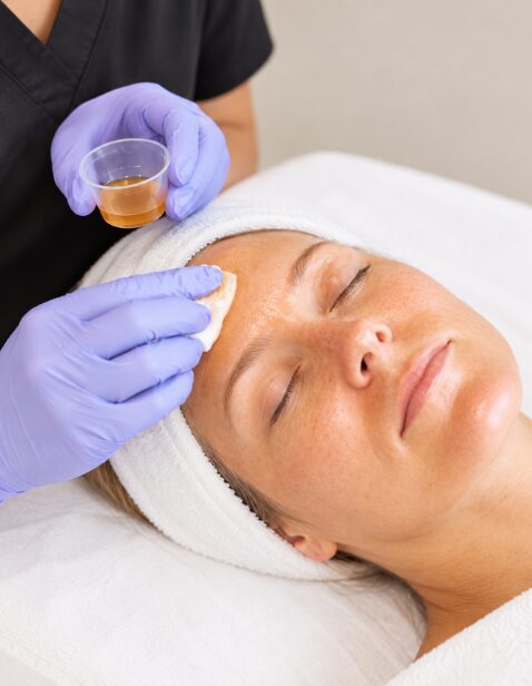 Client receiving an Obagi Radiance Peel facial treatment in Germantown, TN, serving clients throughout the Greater Memphis area.